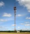 Older style tower being reused for a few microwave dishes and other unknown antennas up top. 